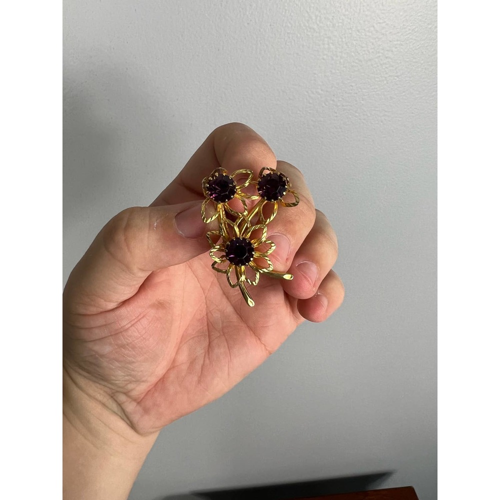 Gold and purple bejeweled three flower brooch
